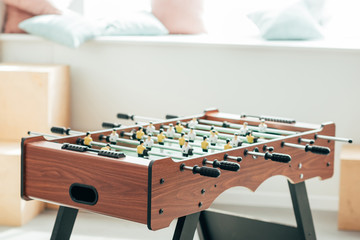Fototapeta premium closeup shot of table football with cushions on window sill