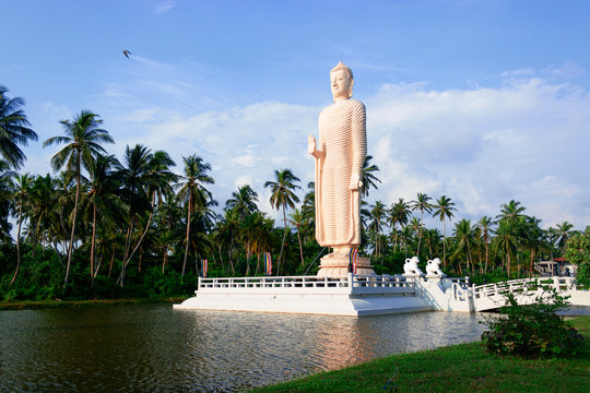 Big white Buddha in Hikkaduwa, Sri Lanka. The statue near Tsunami museum and Tsunami Memorial - a popular tourist place in Peraliya.