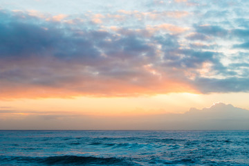 Ocean water and sky at sunrise time.