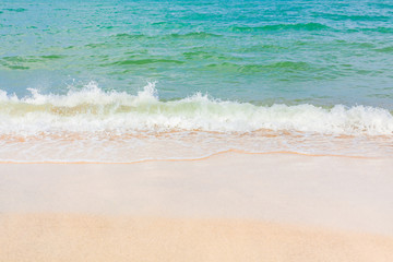 Fototapeta na wymiar Wave and sand beach tropical sea.