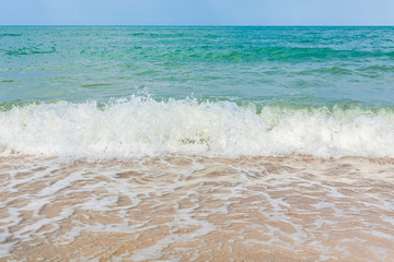 Wave and sand beach tropical sea.