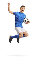 Fototapeta na wymiar Overjoyed teenage soccer player jumping