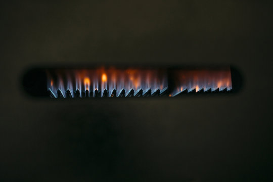 Close-up of Gas Burner Flames with Blue and Orange Hues