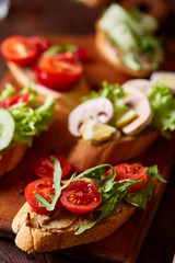 Breakfast still life with sandwiches, quail eggs, spicies and fresh fruits and vegetables, selective focus