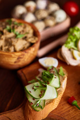 Breakfast still life with sandwiches, quail eggs, spicies and fresh fruits and vegetables, selective focus