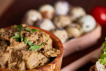 Paste from chicken liver with vegetable sandwiches , shallow depth of field, close-up, vertical.