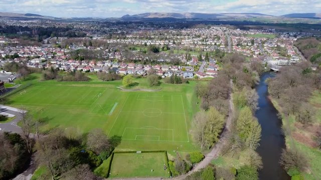 Aerial footage over Bearsden in Glasgow to the Campsie Fells in the distance.