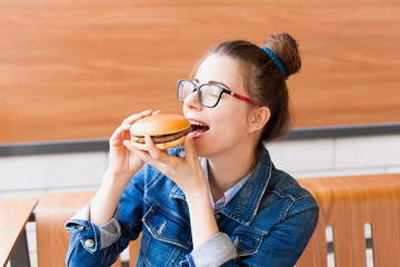 Girl, jeans jacket, fun, close up, glasses, cafe, burger