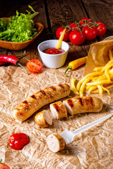 rustic bratwurst with pommes and hot ketchup