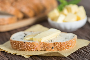 Sliced of Sesame bread with butter.