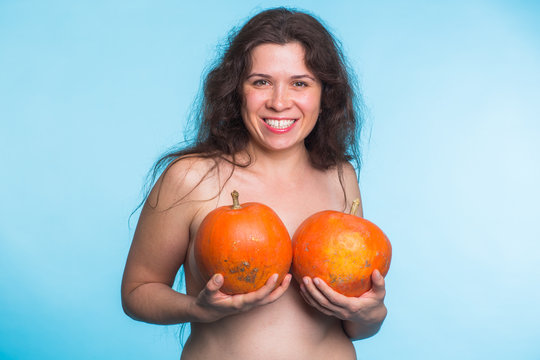 Plastic surgery concept - woman breast pumpkins implant upsize metaphor