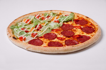Pizza with salami and chicken isolated on white