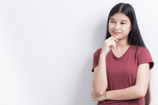 Asian Women Are Standing And Thinking On White Background.