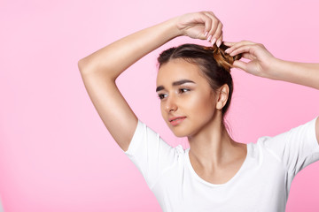 young woman on pink background Attractive beautiful woman showing air kiss