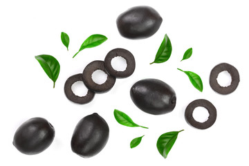 Fototapeta na wymiar whole and sliced black olives decorated with leaves isolated on white background. Top view. Flat lay pattern