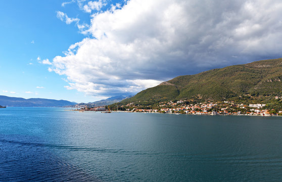 Montenegro. The coast of Kotor Bay. Beautiful view from the sea to the port and the town of Djenovici