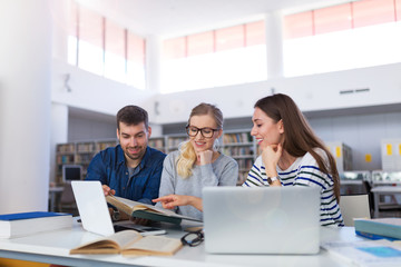University students working in the library at campus
