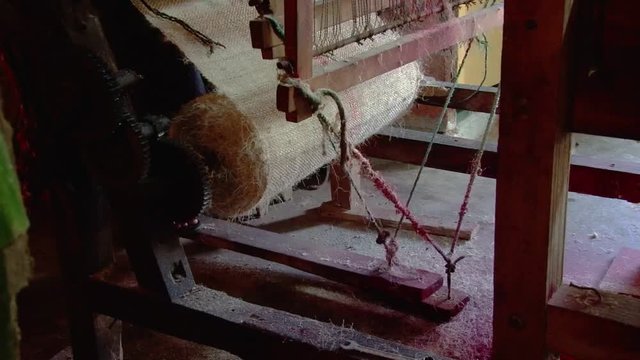 Shot of treadles on loom at workshop in Montecristi, Ecuador