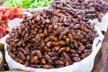 Fresh dates in a market - healthy lifestyle, food and fruit concept