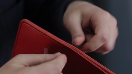 Leather handbag craftsman at work in a workshop.