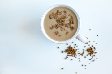 Cup of coffee on a white background, view from above