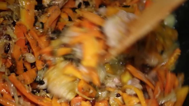 Preparation of rice dishes - pilaf from Uzbekistan. To the meat and spices we add oriental spices cumin, turmeric