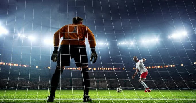 Soccer goalie fails to catch a ball on a prefessional soccer stadium. Athlete wears unbranded sport clothes