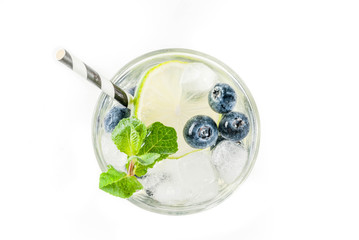 Various berry lemonade or mojito cocktails, fresh iced lemon lime raspberry blueberry infused water, summer healthy detox drinks isolated on white top view