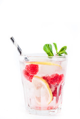 Various berry lemonade or mojito cocktails, fresh iced lemon lime raspberry blueberry infused water, summer healthy detox drinks isolated on white