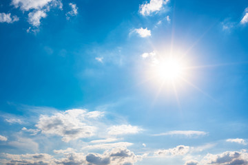 Naklejka na ściany i meble Summer background, blue sky with white clouds and sun