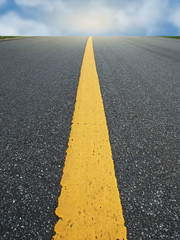 Surface rough of asphalt, Grey with yellow line on the road and small rock, Texture Background