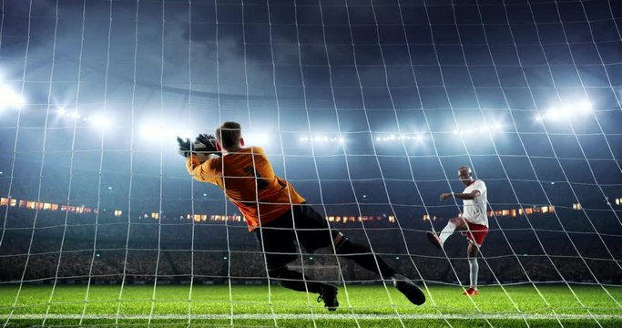 Soccer goalie catches a ball on a prefessional soccer stadium. Athlete wears unbranded sport clothes
