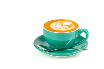 Side view of hot latte coffee with latte art in a green cup and saucer isolated on white background with clipping path inside.