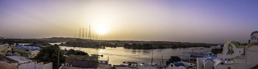Naklejka premium Scenic view of Nile River during sunset in Aswan Egypt