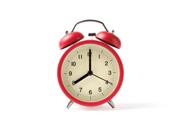 Red vintage alarm clock on white background with clipping path