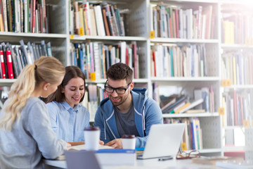 University students working in the library at campus
