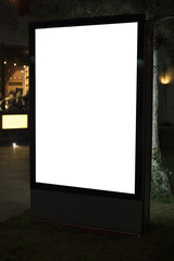 Mockup - Illuminated blank billboard in night city. Place for text, outdoor advertising, banner or public information.