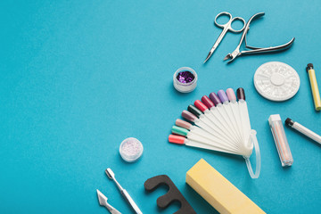 Manicure supplies on blue background