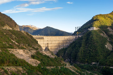 Fototapeta premium The Enguri hydroelectric power station HES. The Jvari Reservoir next to Inguri Dam, surrounded by mountains, Upper Svaneti, Georgia. Second highest concrete arch dam in the world. Jvari location.