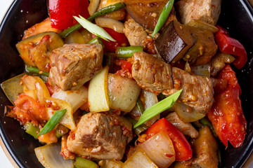 Salad with gently cooked veal and vegetables, piquant sauce. View from above. Close--up