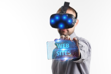 Business, Technology, Internet and network concept. Young businessman working in virtual reality glasses sees the inscription: Web sites