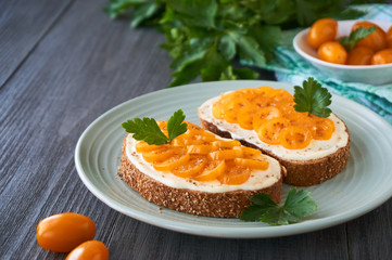 Toast with cheese and yellow tomatoes on a plate 