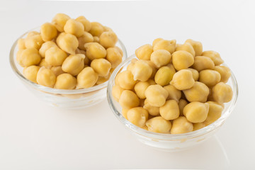 Chickpea grains (Cicer arietinum) in bowl isolated on white background