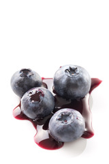 Blueberries And Blueberry Juice On White Background.