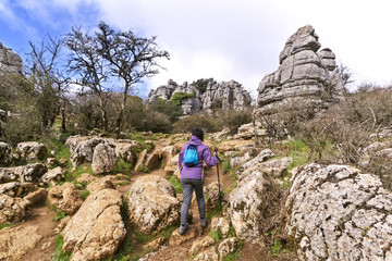 Hiker woman walking in mountains , Torcal in Antequera city  , Spain