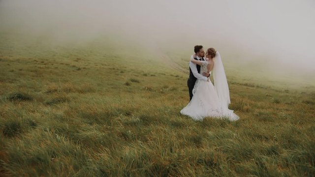 Wedding Couple Walks in Mountains 