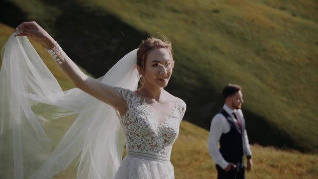 Wedding Couple Walks in Mountains 
