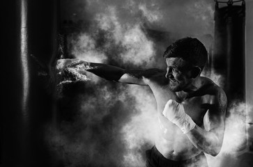 Boxer boxing in punching bag