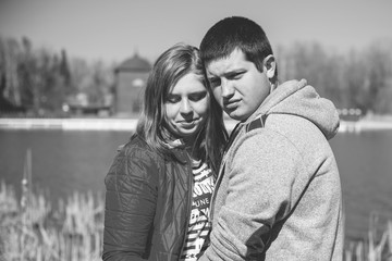 American young couple with overweight walk in park, man and woman together  