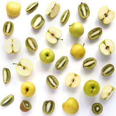 Kiwi and apples in a cut isolated on white background, top view. Creative flat layout of fruits. The concept of healthy eating. Pattern of fresh fruits.